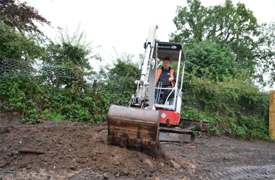 TB217R-550-360-performance-narrow-works-in-tight-sites-takeuchi-compact-excavator.jpg